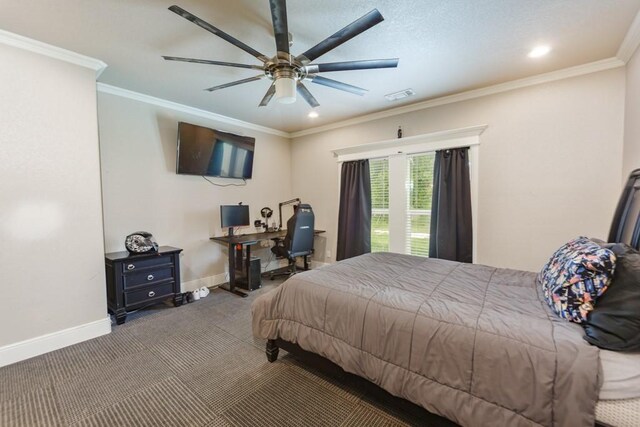 carpeted bedroom with ornamental molding and ceiling fan