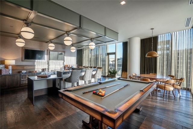 rec room featuring floor to ceiling windows, dark wood-type flooring, indoor bar, and billiards