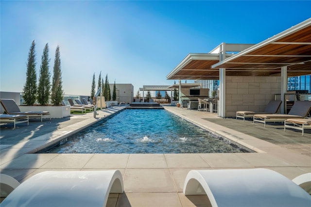 view of swimming pool with a patio area and pool water feature