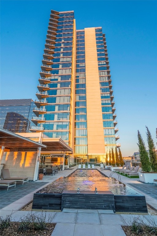 view of outdoor building at dusk