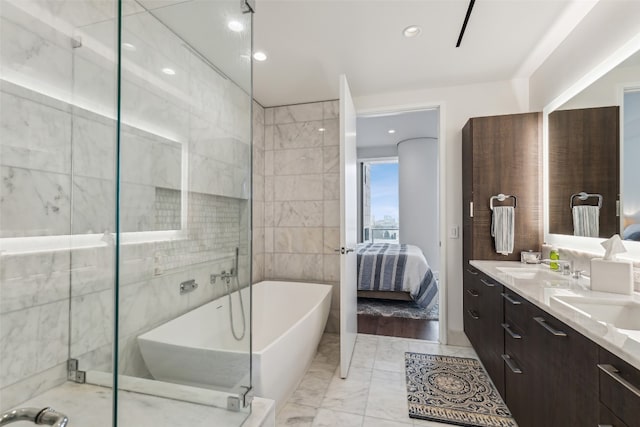 bathroom featuring tile walls, independent shower and bath, tile floors, and double sink vanity