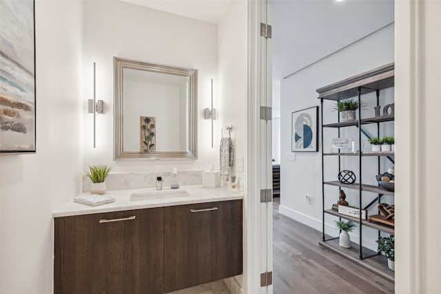 bathroom with vanity and hardwood / wood-style flooring