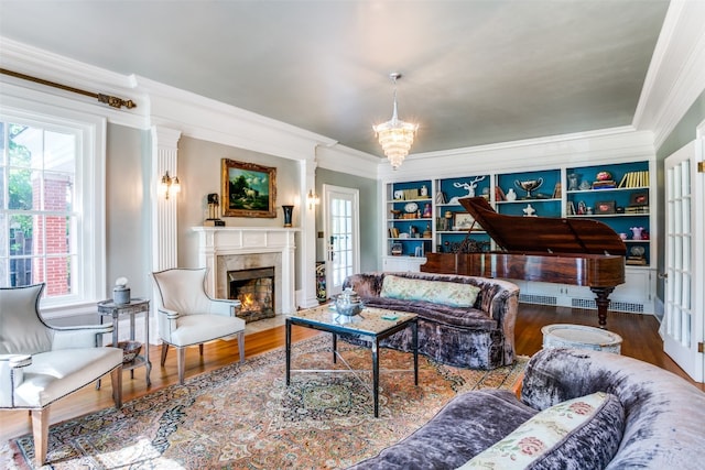 living room with ornamental molding, dark hardwood / wood-style flooring, and plenty of natural light