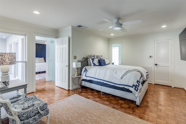 bedroom with parquet flooring, ceiling fan, and ornamental molding