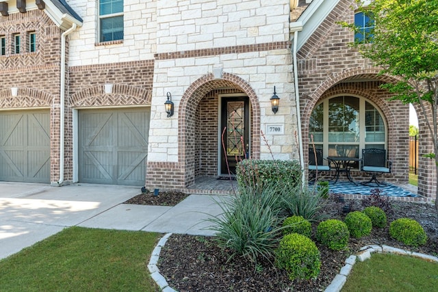 doorway to property with a garage