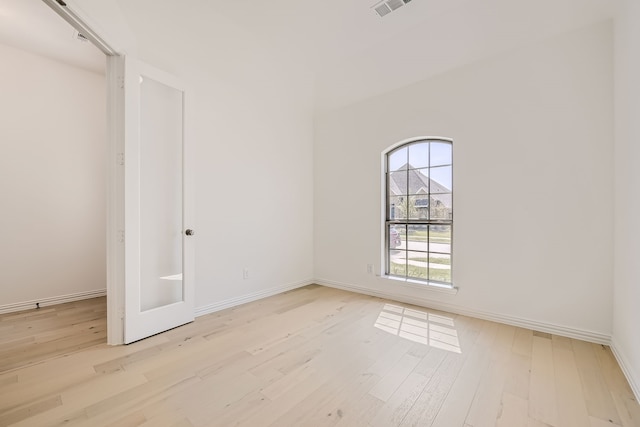 spare room featuring light hardwood / wood-style flooring