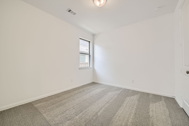 spare room featuring carpet flooring