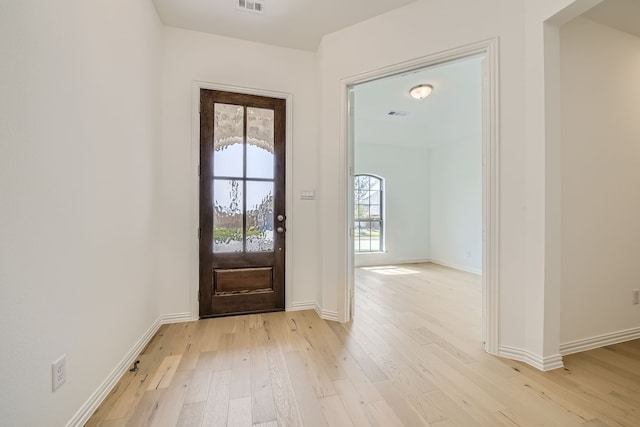 foyer entrance with light hardwood / wood-style flooring