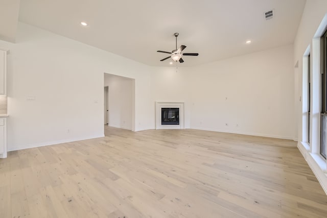 unfurnished living room with light hardwood / wood-style floors and ceiling fan