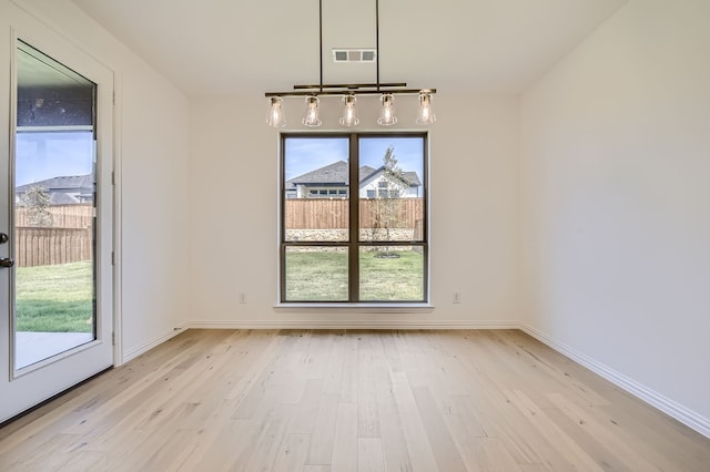 unfurnished dining area featuring light hardwood / wood-style floors