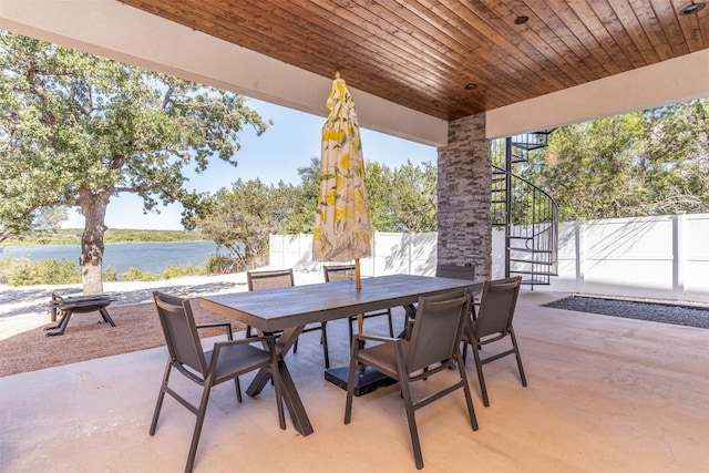 view of terrace with a water view