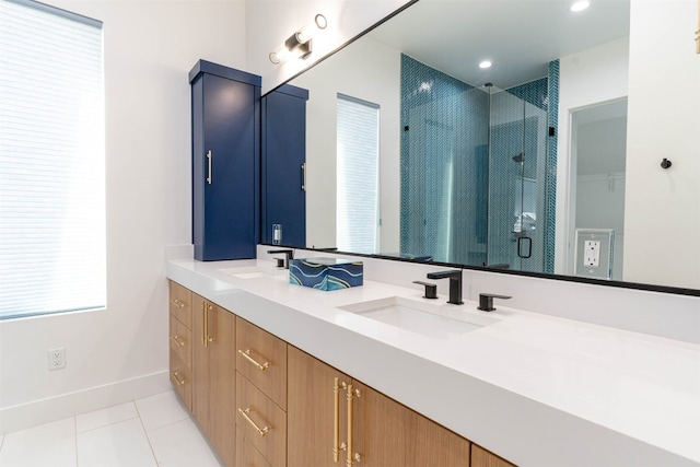 bathroom with walk in shower, tile floors, and double vanity