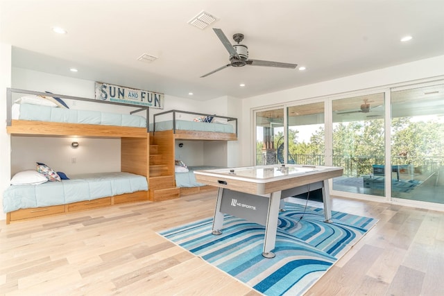 interior space featuring ceiling fan, light wood-type flooring, and access to outside