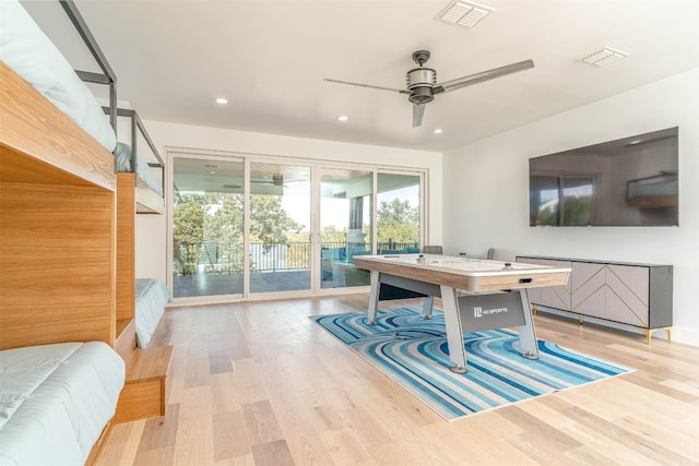 interior space featuring ceiling fan and light wood-type flooring