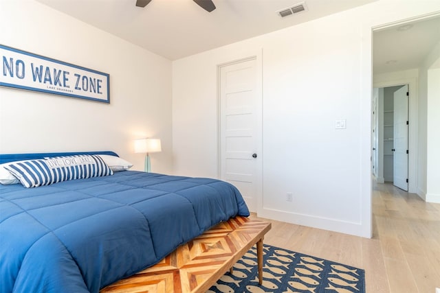 bedroom featuring a closet, ceiling fan, and light wood-type flooring