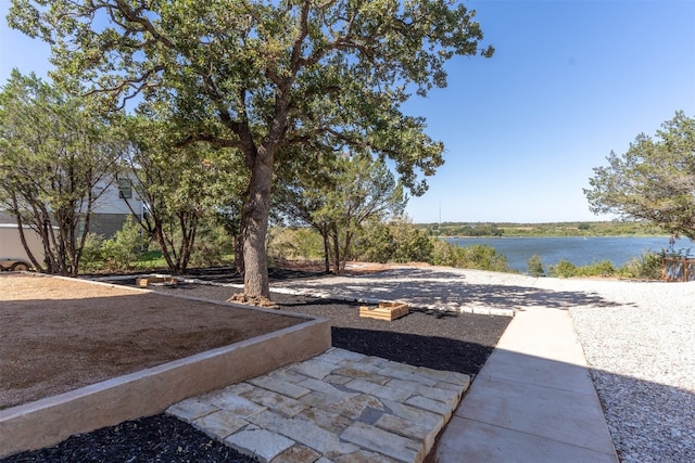 view of terrace featuring a water view