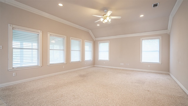 spare room featuring light carpet, ceiling fan, and crown molding