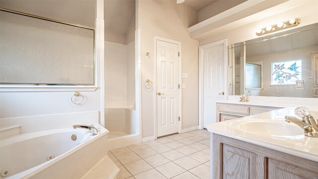 bathroom with independent shower and bath, vanity, and tile patterned floors