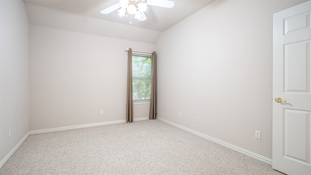 empty room with carpet floors, lofted ceiling, and ceiling fan