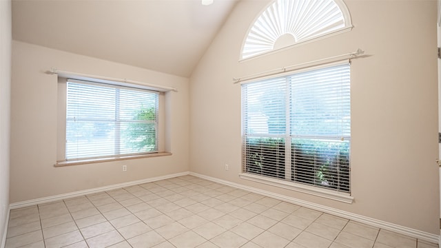 tiled empty room with high vaulted ceiling