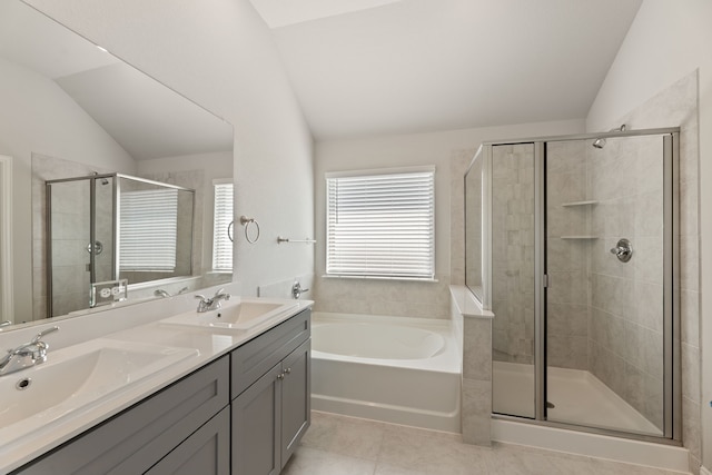 bathroom with tile patterned flooring, lofted ceiling, independent shower and bath, and vanity