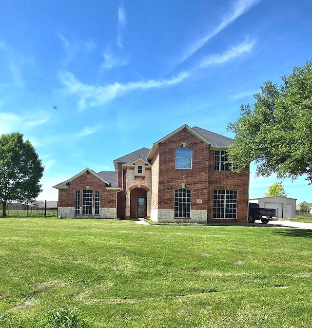 view of front of home with a garage and a front yard