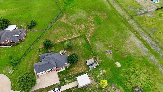 birds eye view of property featuring a rural view