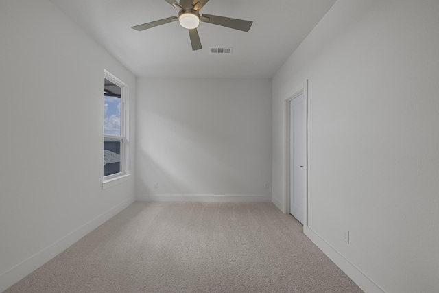 carpeted empty room with ceiling fan