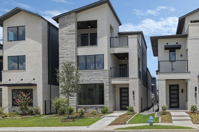 view of front of property with a balcony