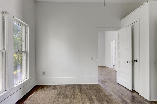 spare room featuring dark hardwood / wood-style flooring