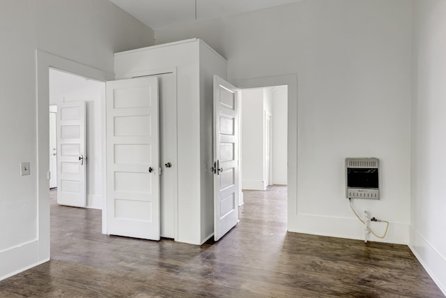 unfurnished bedroom with dark wood-type flooring