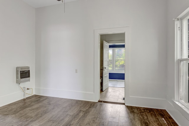 empty room with ceiling fan and hardwood / wood-style floors