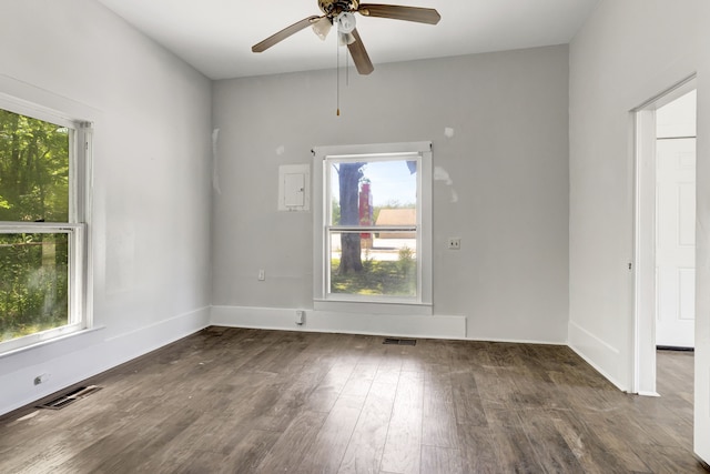 spare room featuring ceiling fan and dark hardwood / wood-style floors