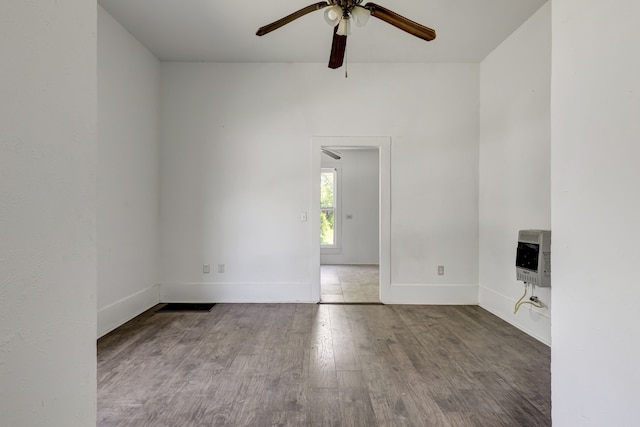 unfurnished room with hardwood / wood-style flooring and ceiling fan