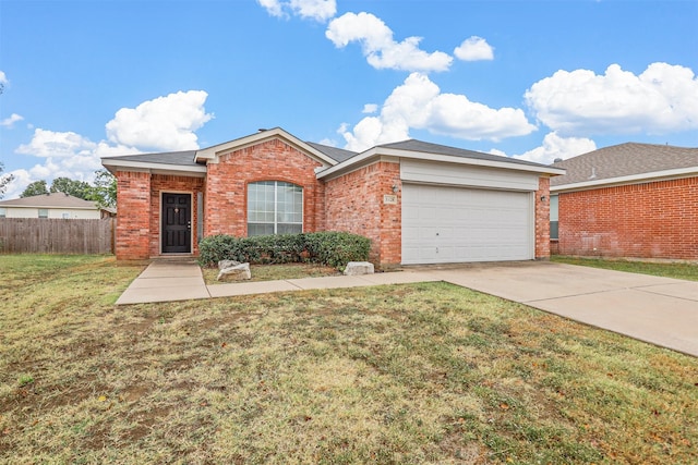 ranch-style home with a garage and a front yard