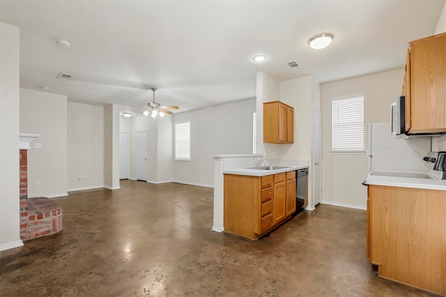 kitchen with a brick fireplace, black dishwasher, stove, and plenty of natural light