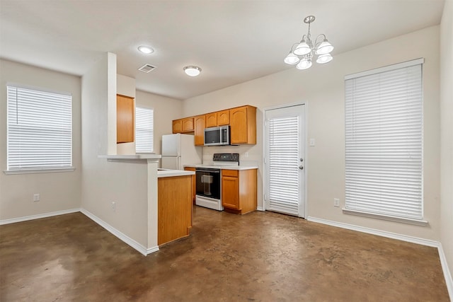 kitchen with kitchen peninsula, white appliances, an inviting chandelier, and hanging light fixtures