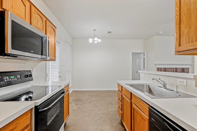 kitchen with black appliances, a chandelier, decorative light fixtures, and sink