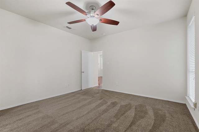 empty room featuring carpet and ceiling fan