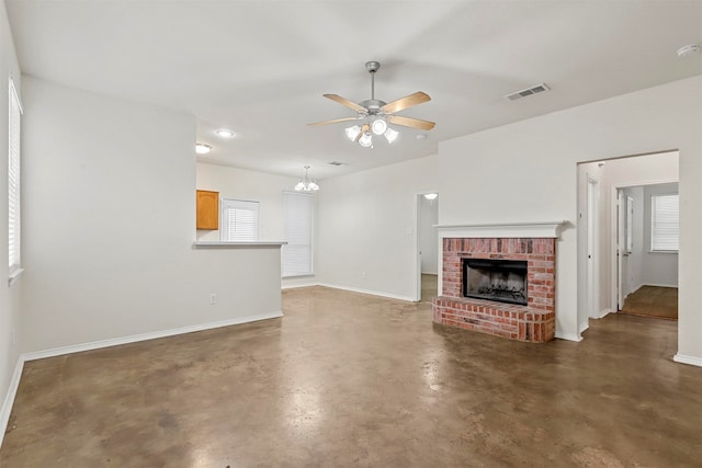 unfurnished living room featuring ceiling fan and a fireplace