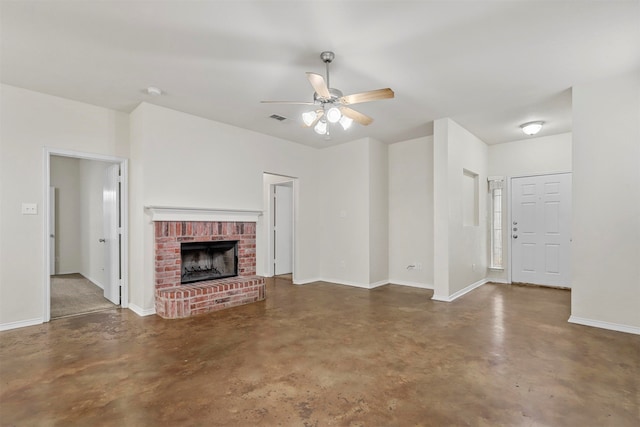 unfurnished living room with a fireplace and ceiling fan