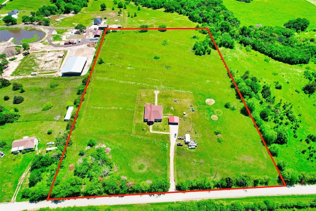 drone / aerial view with a water view and a rural view