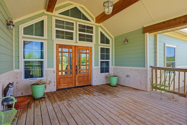 view of exterior entry featuring french doors