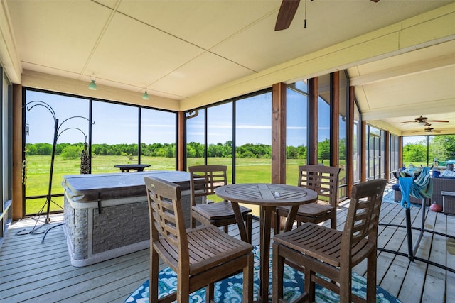 sunroom / solarium with ceiling fan