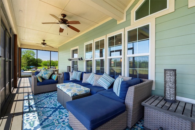 sunroom with a ceiling fan