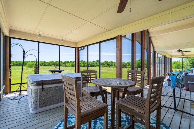 sunroom with ceiling fan