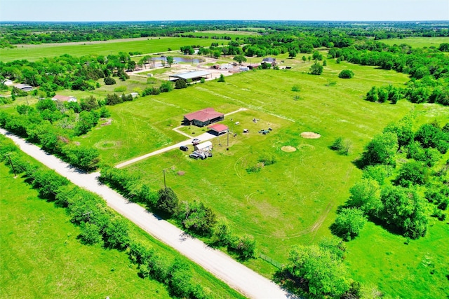 birds eye view of property with a rural view