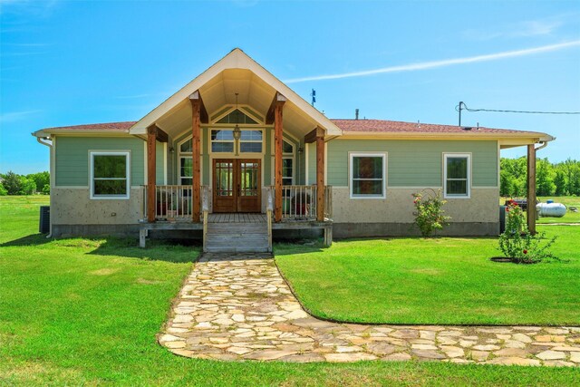 view of front of house with french doors and a front yard