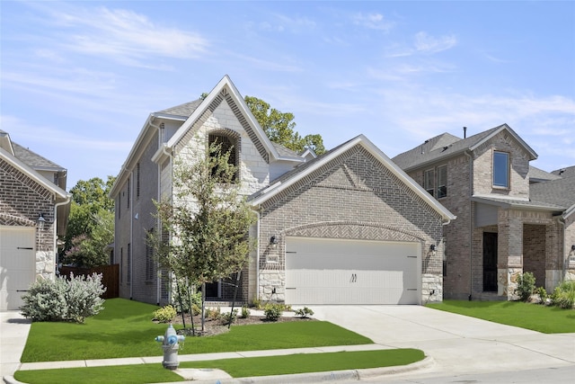 view of front facade featuring a front yard and a garage