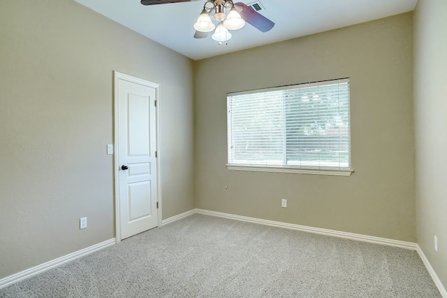 carpeted empty room with ceiling fan